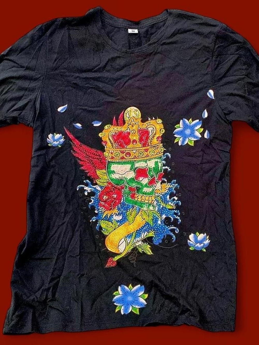 Unlisted Black Tee with Colorful Crowned Skull Graphic